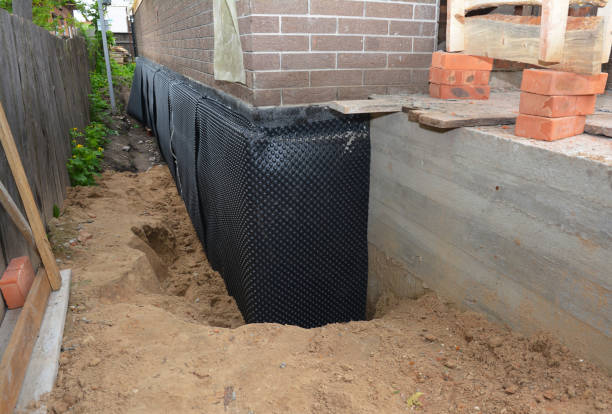 Happy homeowners after waterproofing job in Norwich